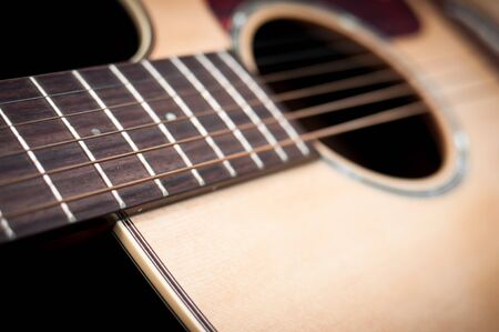 Close-up guitar body with sound hole and stringsの写真素材