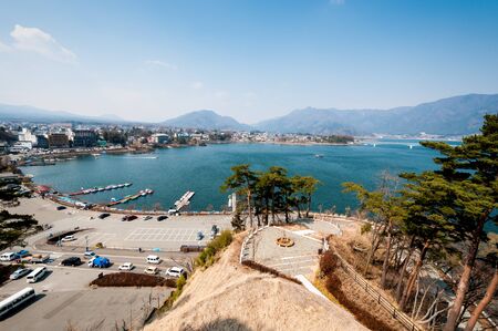 Lake Kawaguchiko view from high angle. Show detail of city, port and the road.の写真素材