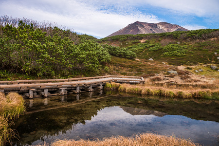 Asahidake summit in Daisetsuzan national park and small pondの写真素材