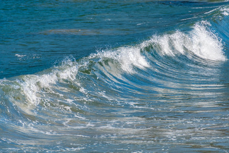 Sea wave on the beach. Close-up of sea wave.