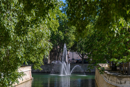 Fountain on rue Fontaine, Nimes, Franceの写真素材