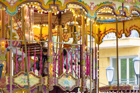 Colorful carousel in the amusement park, closeup of photo. Landscape with merry-go-round, Nimes, Franceの写真素材