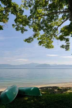 Boats on the shore of Lake Towada. Aomori, Japanの写真素材