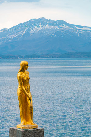 Statue of Tatsuko at Lake Tazawa, the deepest lake in Japan. and Akita Komagatake. Akita, Japanの写真素材
