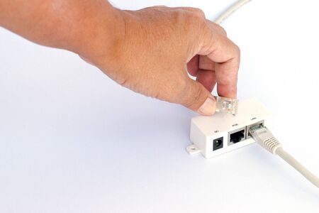 UTP LAN cable plugin into the LAN connection, isolated on white