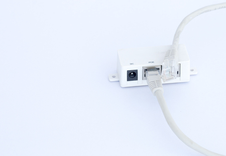UTP LAN cable plugin into the LAN connection, isolated on whiteの写真素材