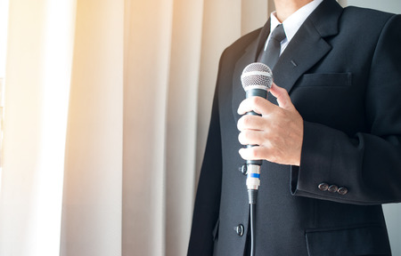 Smart businessman speech and speaking with microphones in seminar room or talking conference hall...
