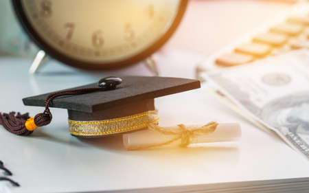 Graduate study international abroad concept, Graduation cap scroll certificate near documents report...
