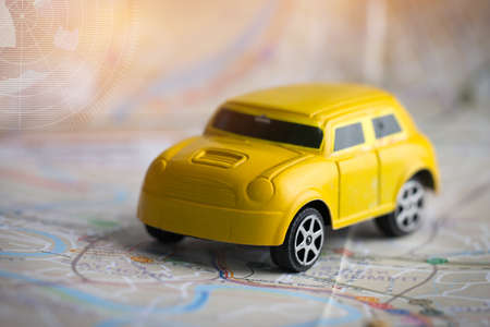 Miniature or small Yellow Car with GPS on Bangkok city map, Concept for travel around direction to destination. Adventure begins right now, Travel Conceptの写真素材
