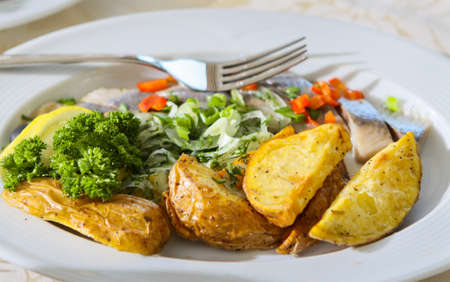 Pieces of fish and potato a table on  wedding banquet の写真素材