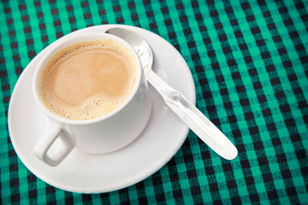 Morning cup of fresh coffee with a spoonの写真素材