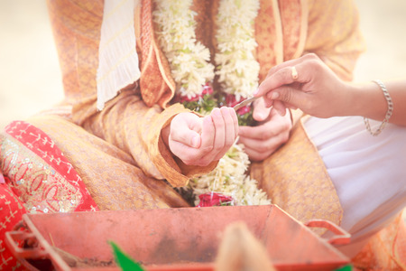 newlywed hands with mehendi and braceletsの写真素材