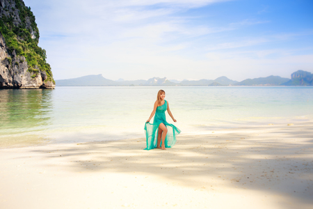 young happy asian girl in green dressの写真素材