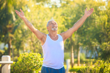 european gray bearded old man shows yoga poseの写真素材