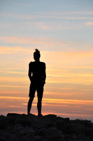 staring at the sunsetの写真素材