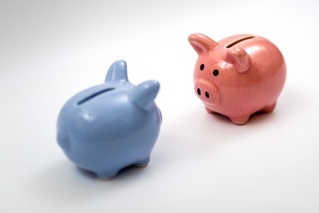 symbol of year piggy bank pink and blue on white backgroundの写真素材