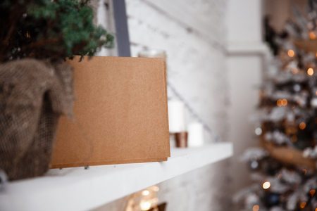 Kraft envelope lies on the white shelfの写真素材