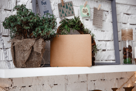 Kraft envelope lies on the white shelfの写真素材