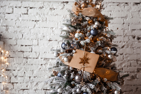 Kraft envelope lies on the branches of the Christmas treeの写真素材