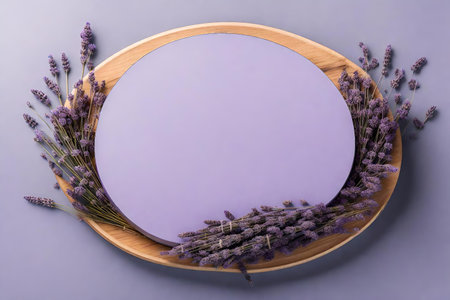 Wooden plate with lavender flowers on gray background, top viewの素材