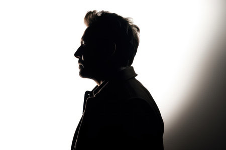 silhouette of man from behind on white background looks awayの素材
