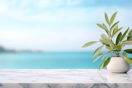 A blank white marble table is featured against a backdrop of a blurred blue sky and sea with a bokehの素材