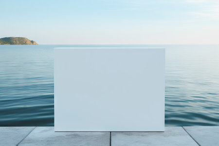 A white square podium is placed on a background of water surface, creating a flat lay image. There iの素材