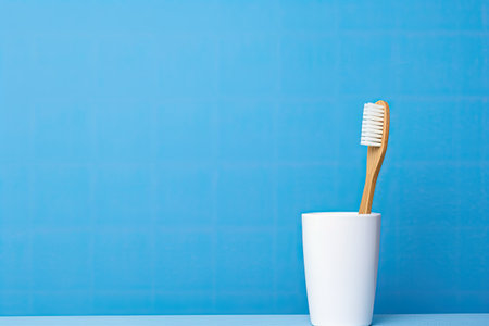 On a blue background with ample space for text there is a composition featuring a single wooden bambの素材