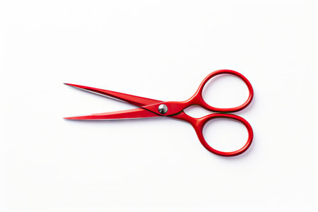 Isolated red scissors on white backdropの素材
