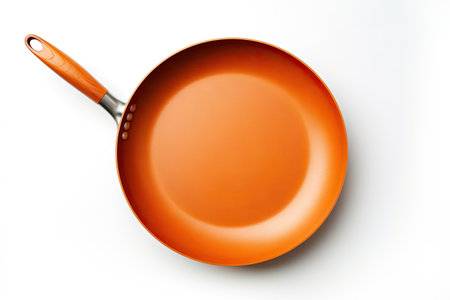 Frying pan on a white surfaceの素材