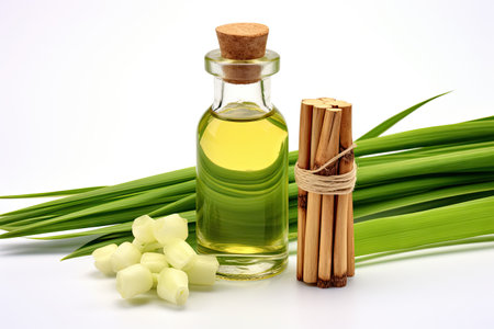 Lemongrass extract in amber bottle with fresh lemongrass on white backgroundの素材
