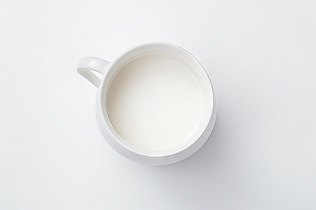 Top down perspective of milk container with milk on a white surfaceの素材
