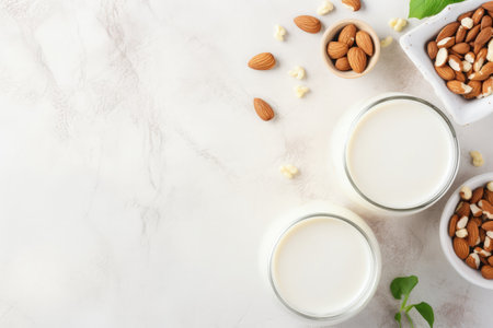 Top view of a variety of vegan dairy free milk options made from nuts and grains suitable for healthの素材