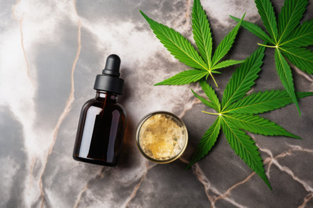 CBD oil THC tincture and hemp leaves on marble background Minimalistic cosmetic Hemp oil cream withの素材