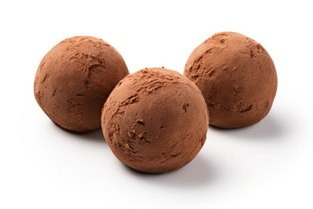 Three chocolate ice cream balls brown and isolated on white backgroundの素材