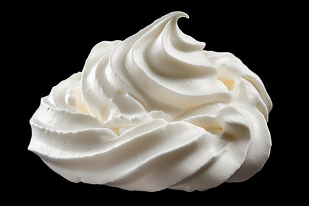 Whipped cream or meringue on black backgroundの素材