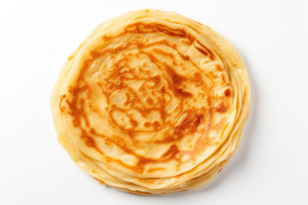 Close up top view of a homemade Russian pancake on a white backgroundの素材