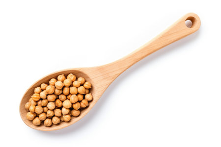 Top view of dry organic chickpeas on white background held by wooden spoonの素材
