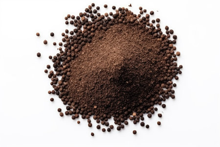 Top view of isolated ground black pepper on a white backgroundの素材