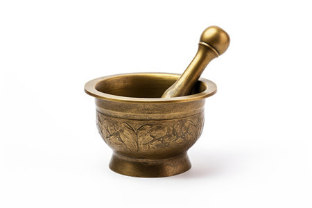 Isolated antique brass mortar with pestle on white backgroundの素材