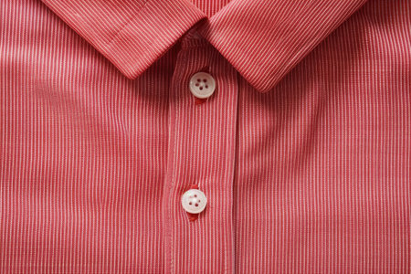 Zoomed in on a standard red shirt with line design.の素材