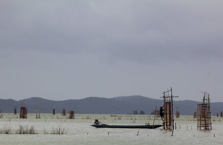 fisherman were fishing in the Songkla lake の写真素材