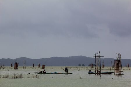 fisherman were fishing in the Songkla lake の写真素材