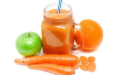 A refreshing smoothie made from orange and apple carrots for a detox healthy dietの写真素材