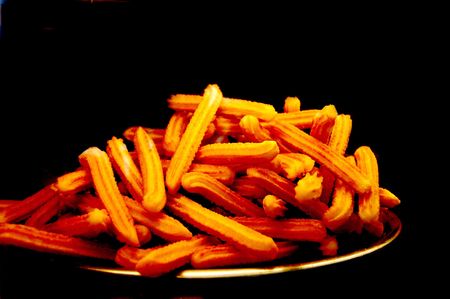 Churros isolated on black の写真素材