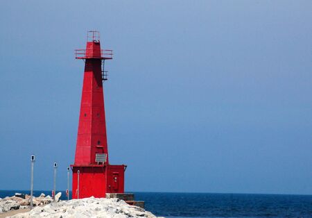 Red lighthouse on lake Michigan, Muskegon, MIの写真素材