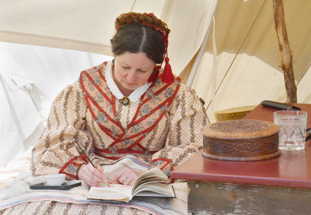 DEARBORN, MI - MAY 26: Civil-war era re-enactor working on a watercolor during the Civil War...