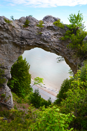MACKINAC ISLAND, MI, USA- JUNE 21: Arch Rock in Mackinac Island, MI, shown here on June 21, 2014, is fifty feet wide and was formed by erosion of the soft rock underneath the breccia rock that remains.のeditorial素材