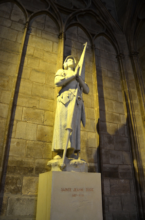 PARIS - AUG 11:  A Joan of Arc statue can be seen in Notre-Dame de Paris cathedral in Paris, France on August 11, 2016.のeditorial素材