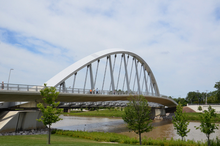 COLUMBUS, OH - JUNE 28: Main Street Inclined Arch Suspension BridgeÂ at Bicentennial Park is shown on June 28, 2017. It was designed by Dr. Spiro Pollalis.のeditorial素材